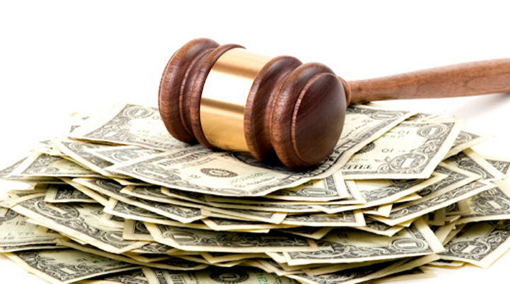 A gavel on top of a pile of money