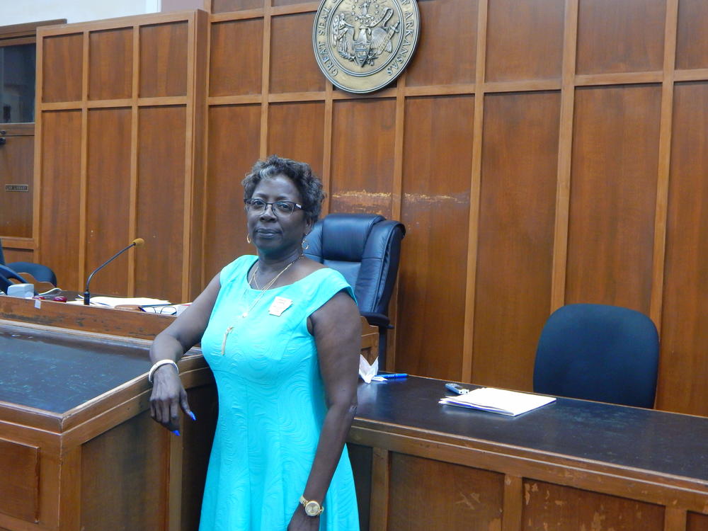 Circuit clerk Janice Currie standing by a podium 