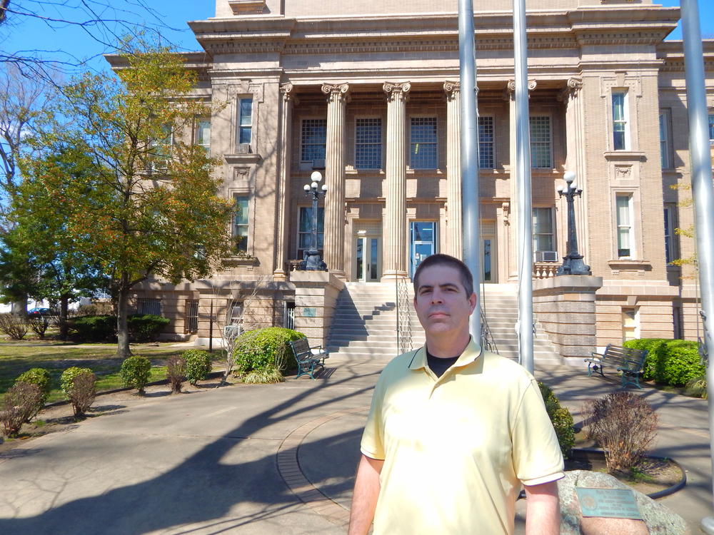 Wayne Reynolds standing in front of the office of emergency management