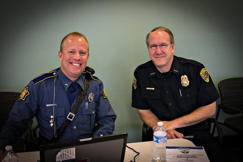 Two police officers smiling for the camera