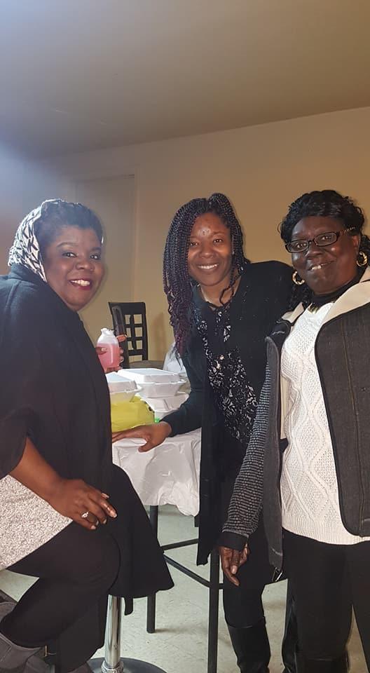 Three women smiling for the camera